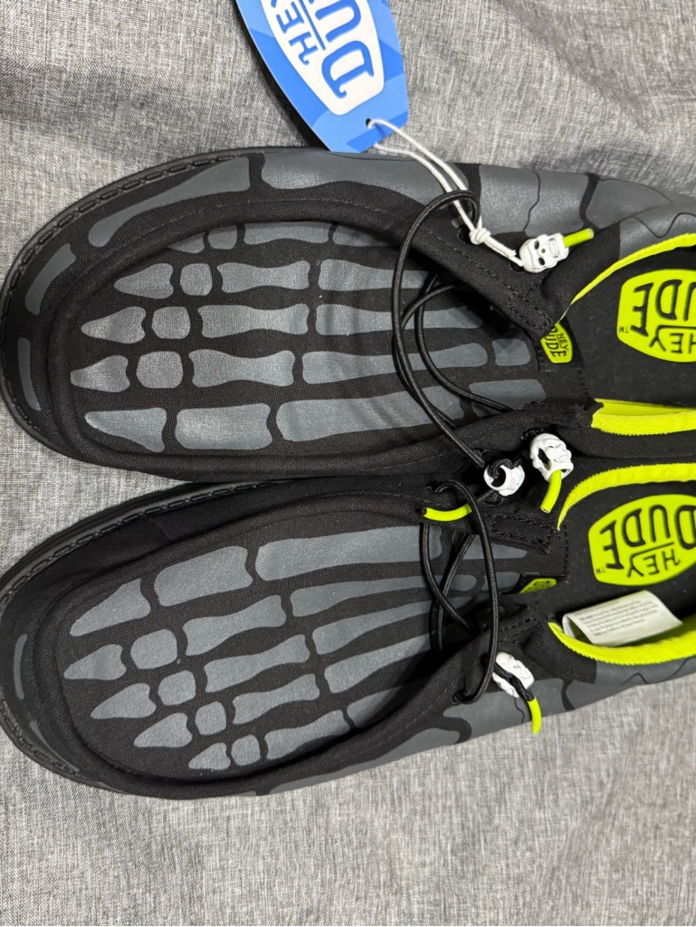 Hey Dude Black Slip-On Shoes with Neon Yellow Accents and Skeleton Footbed